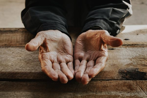 close up of male wrinkled hands old man is wearing on the wood vintage tonexa